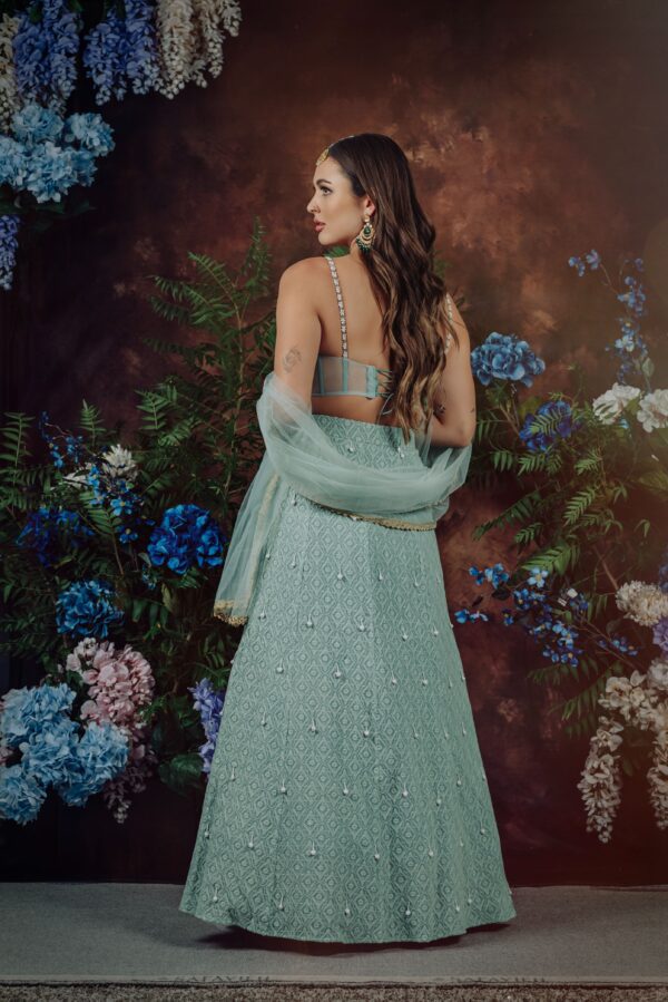 An indian woman in a light blue SIALA.