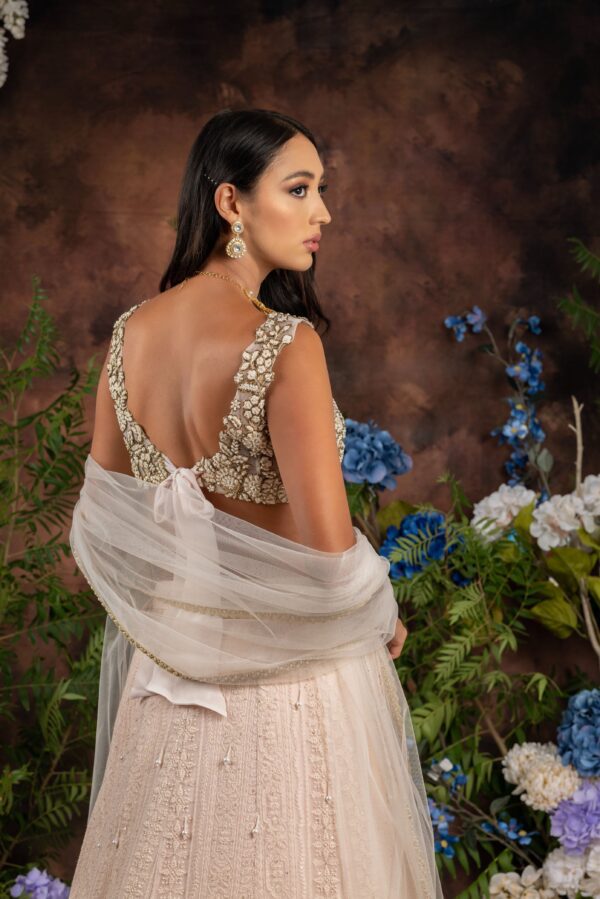 The back view of a model in a Niaa lehenga.